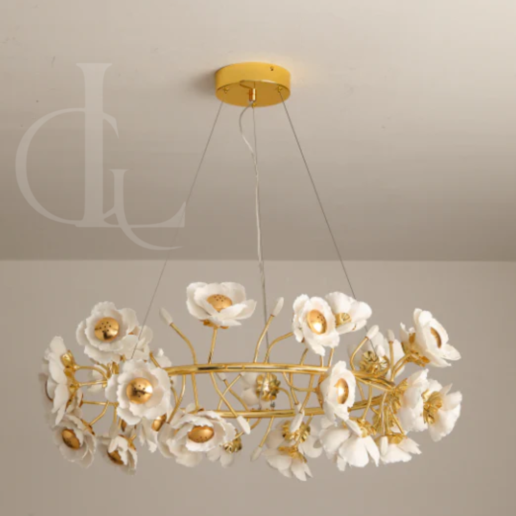 Chandelier with white floral fixtures and gold accents on a neutral background