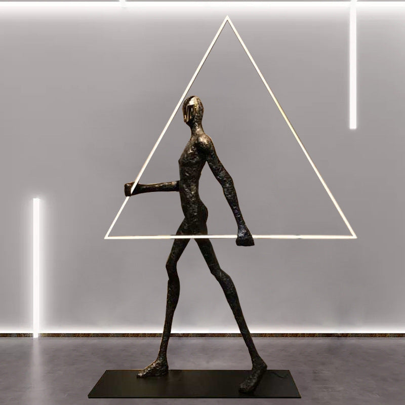 Human Holding Triangle Sculpture